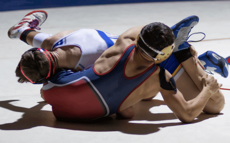 Two wrestlers engage in a historic wrestling match, employing ancient techniques and following strict rules